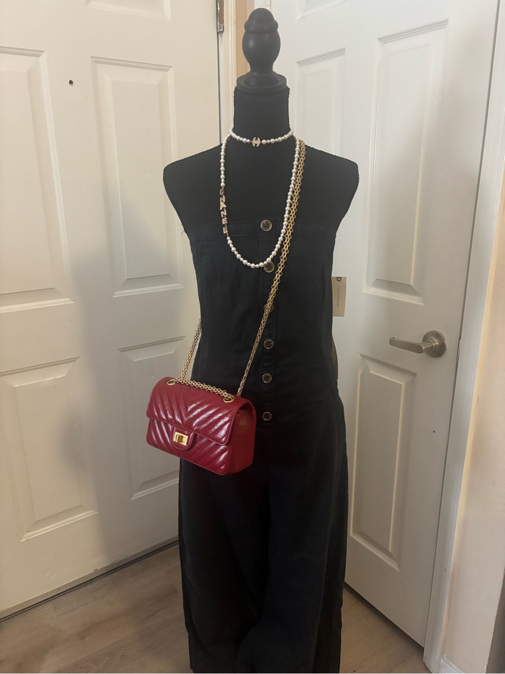 Pilcro denim, black jumpsuit bustier style zippers up the back with pockets
